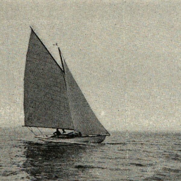 Black and white photograph of Six Metre sailing boat with gaff rig.