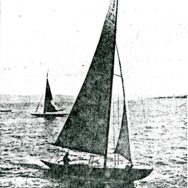 Grainy black and white image of sailing boat.