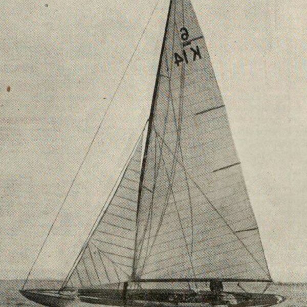 B&W image of a Six Metre boat sailing on water