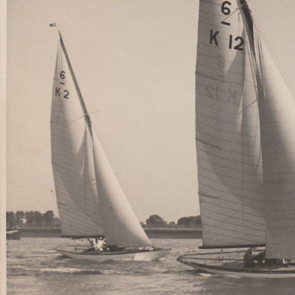 Black and white image of two Six Metre boats sailing