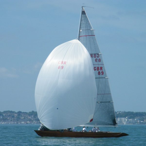 Six Metre sailing boat with spinnaker hoisted