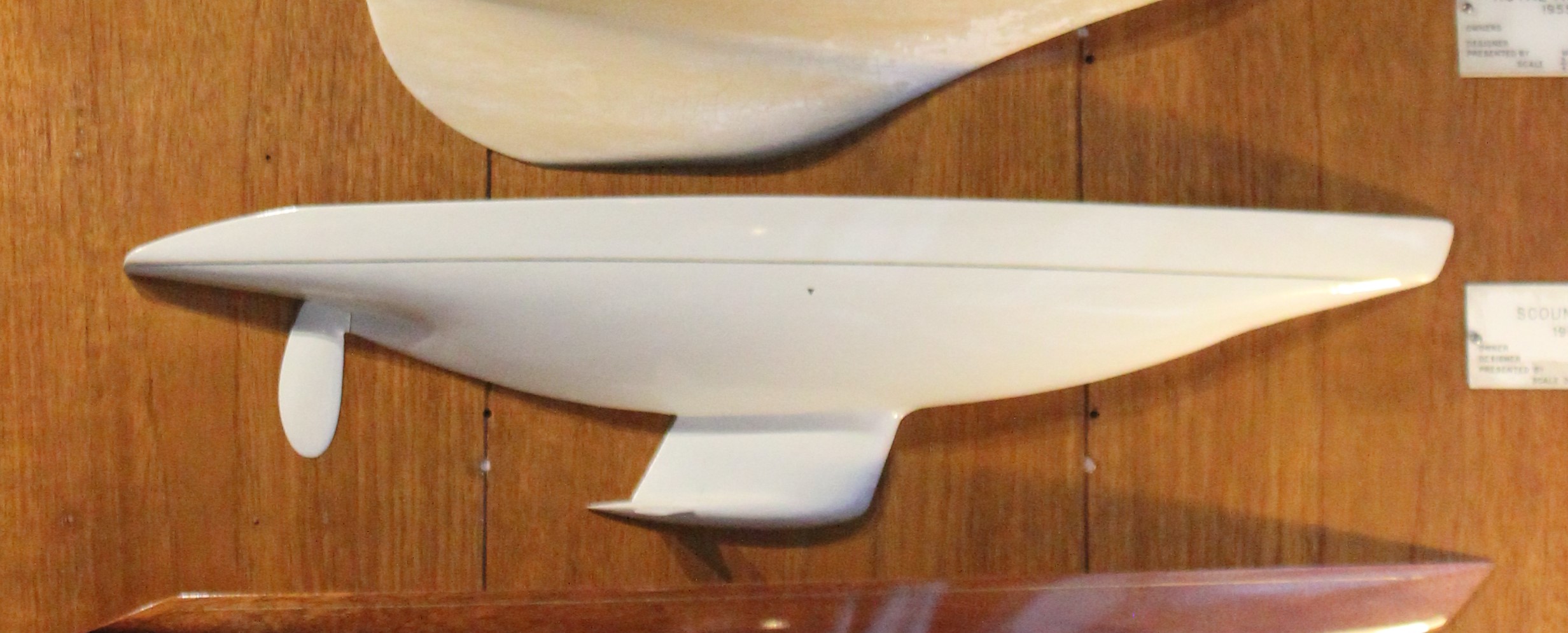 Boat model mounted on a wooden wall