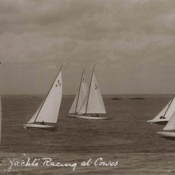 Black and white photograph of racing sailing boats.