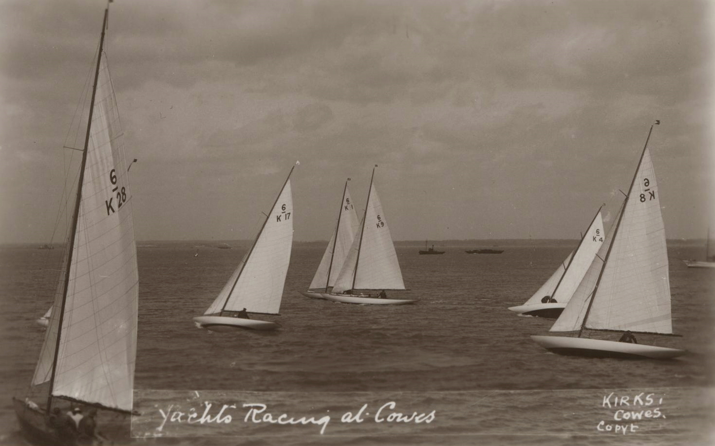 Black and white photograph of racing sailing boats.