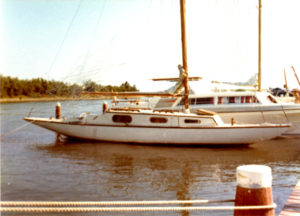 White boat alongside a pontoon.