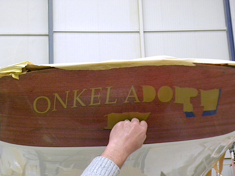 Lettering on the stern of Onkel Adolph boat