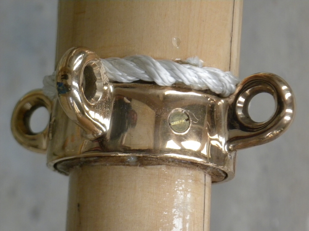 bronze collar on the mast of a boat