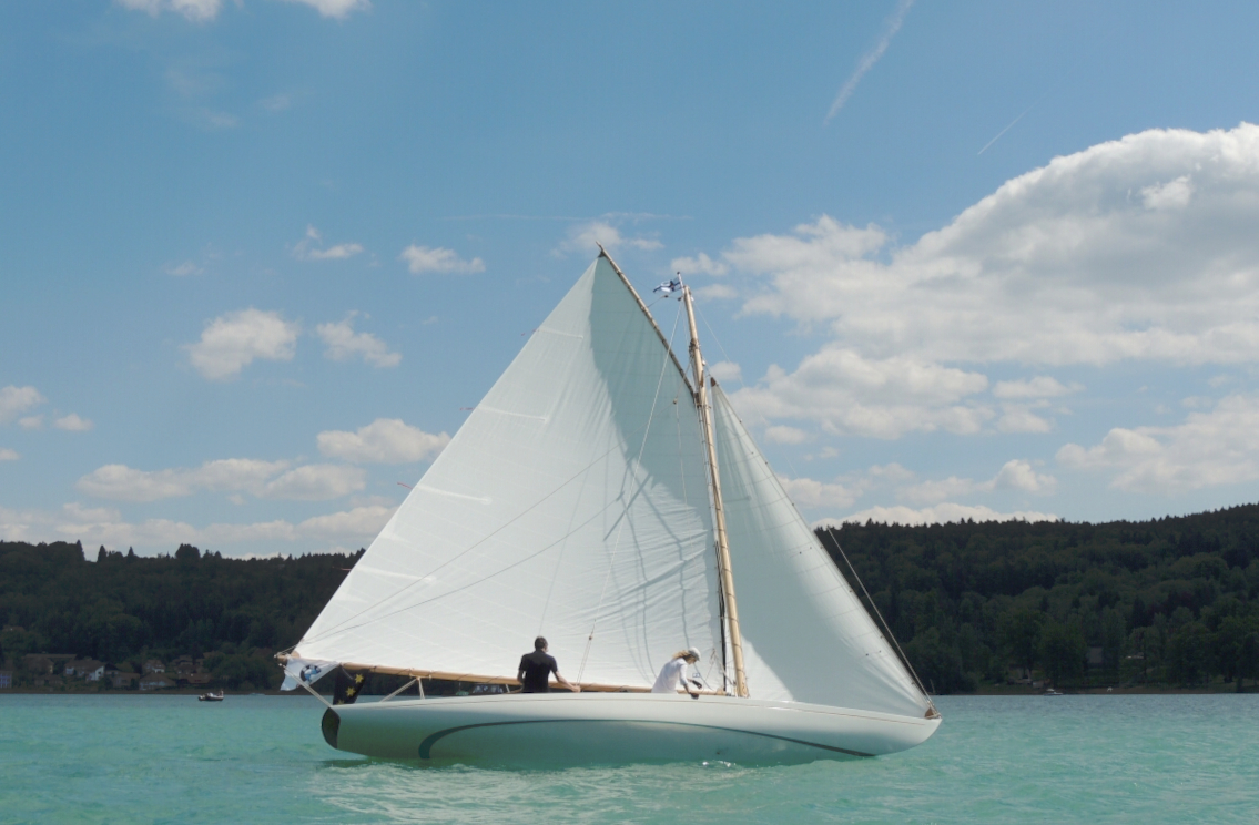 boat sailing in blue waters