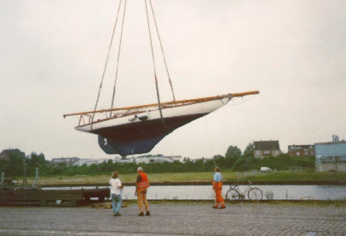A yacht hull on a hoist