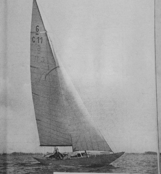 black and white image of a six metre boat sailing on water