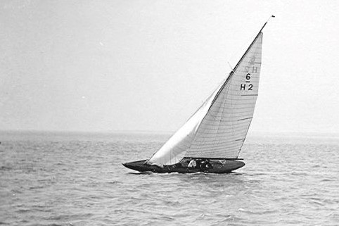 Black and white photograph of Six Metre sailing boat.