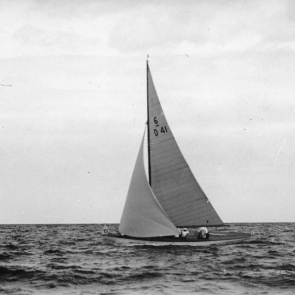 Black and white photograph of Six Metre sailing boat with the number D41 on its sail.