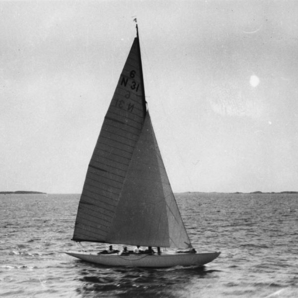 Black and white photo of Six Metre sailing boat.