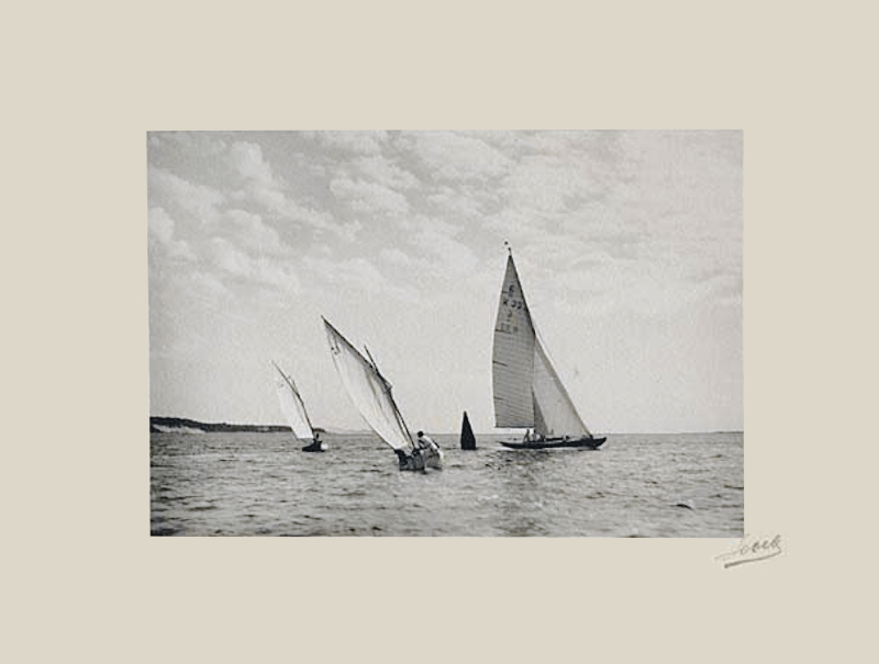 black and white photo of yachts sailing