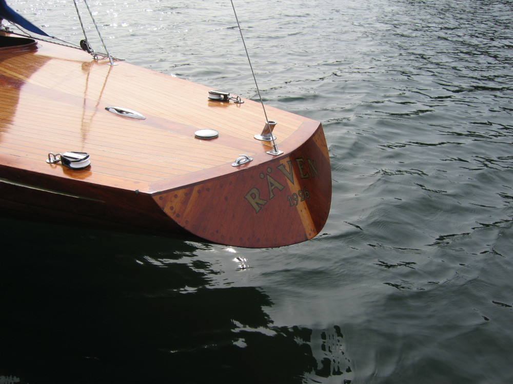 Detail shot of a the stern of a wooden yacht