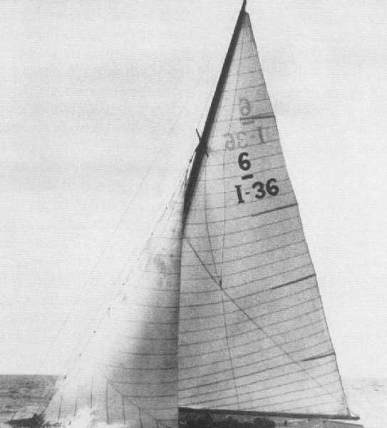Black and white photo of a yacht with a white sail