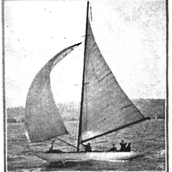 Black and white photo of a yacht with a white sail sailing.