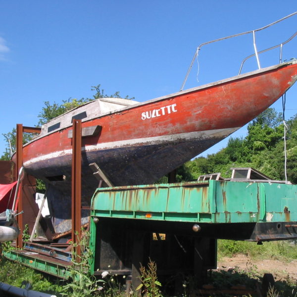 A red and blue yacht hull.
