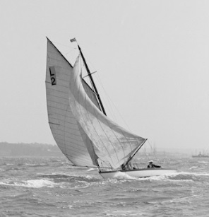 b & w photo of a six metre boat sailing on choppy water