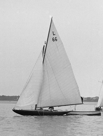 B&W photo of a Six Metre boat sailing on water